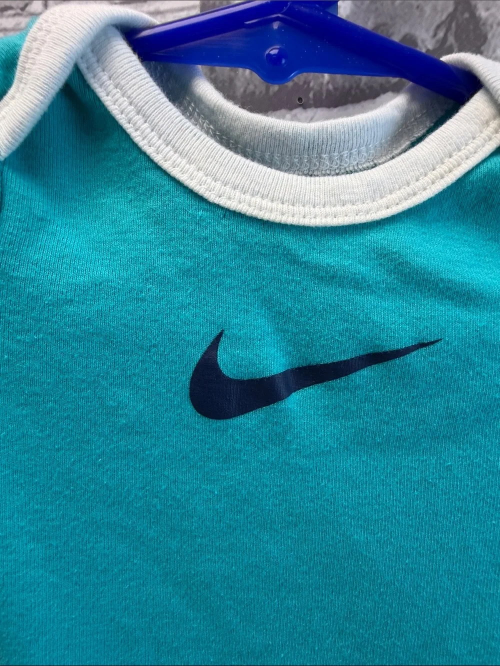 Nike Turquoise and White Baby Bodysuit with Navy Swoosh